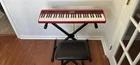 Roland Go:keys GO-61K Red 61-KEY Electronic Keyboard W/ Stand, Bench, Pedal Used. Price: $230.00.