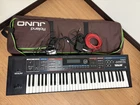 Roland Juno-di Keyboard Synthesizer 61-KEY With Adapter Tested Used. Price: $410.00.
