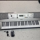 Yamaha Portatone PSR-E313 Portable 61-KEY Midi Electronic Keyboard W/ Power Cord Used. Price: $90.00.