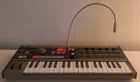 Microkorg Synthesizer Vocoder W/ Mic, Power Supply & Midi Cable Tested Used. Price: $339.99.