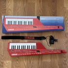 Yamaha SHS-10R Red Digital Shoulder Midi Synthesizer Keyboard Used. Price: $299.00.